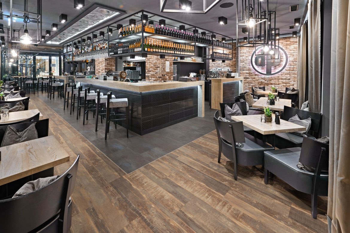 Gerflors Hospitality flooring in a restaurant - Wood and charcoal look.